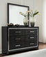 Kaydell Queen Upholstered Panel Bed with Mirrored Dresser and Chest